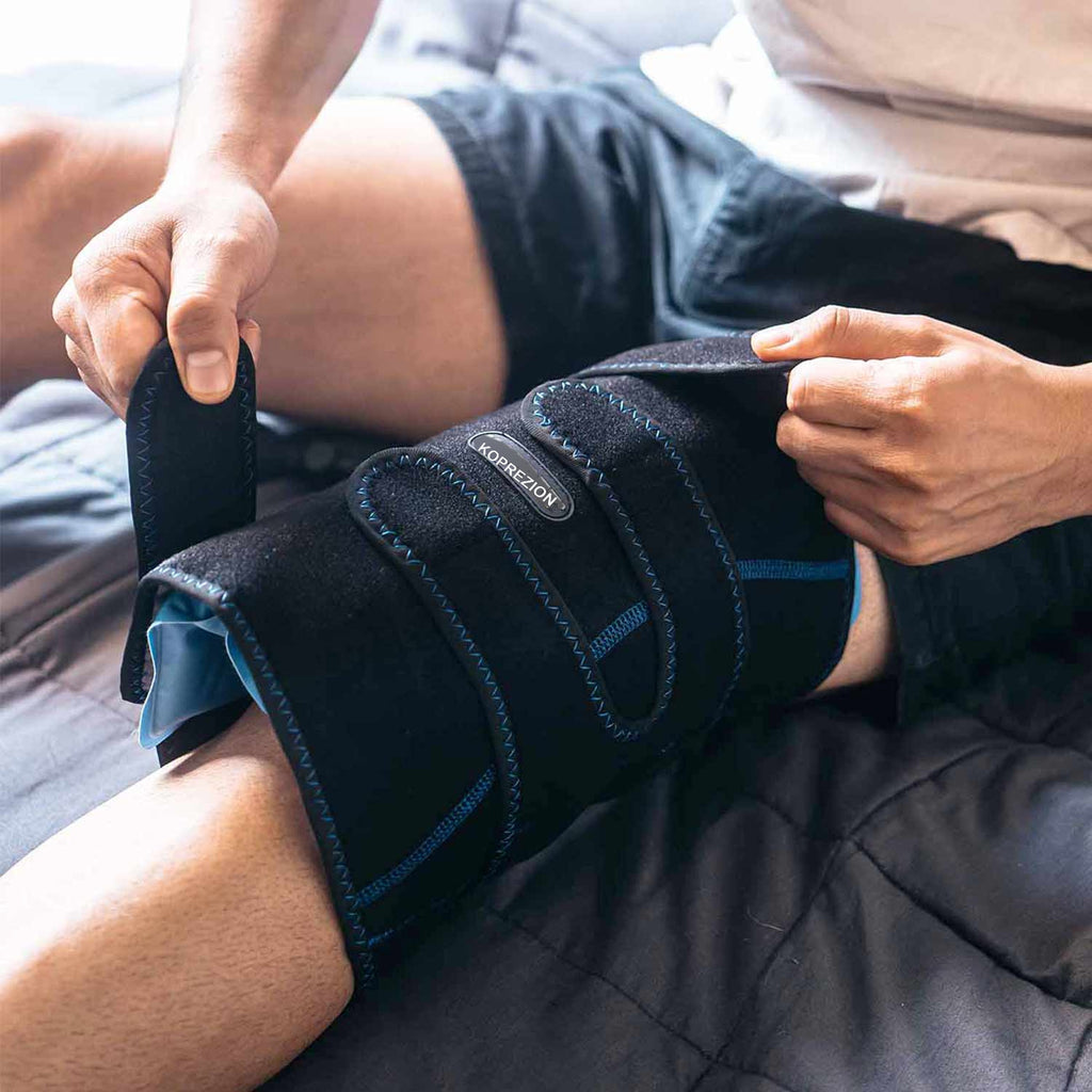 Man adjusting the straps of the Koprezion Knee CryoPump